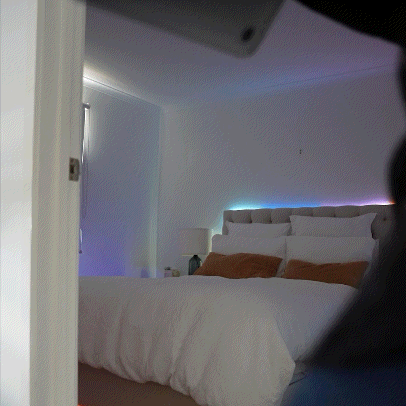 Daily tasks and use on bed with LED Strips emitting from underneath and around bed head