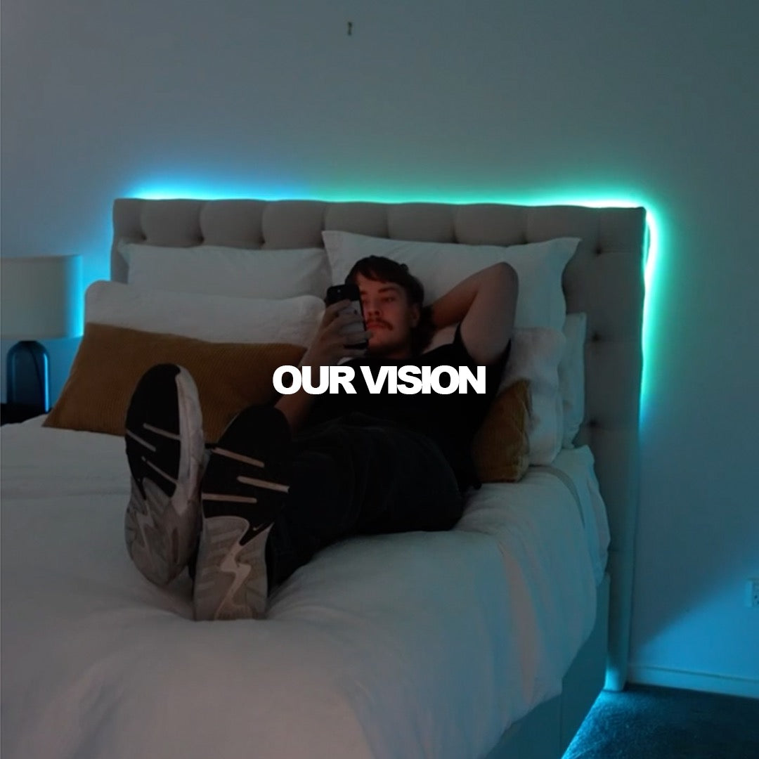 Person relaxing in bed with vibrant colours emitting from bedhead and underneath bed with LED Strips