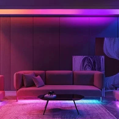 Vibrant LED strips lighting up living room in purple and blue hues